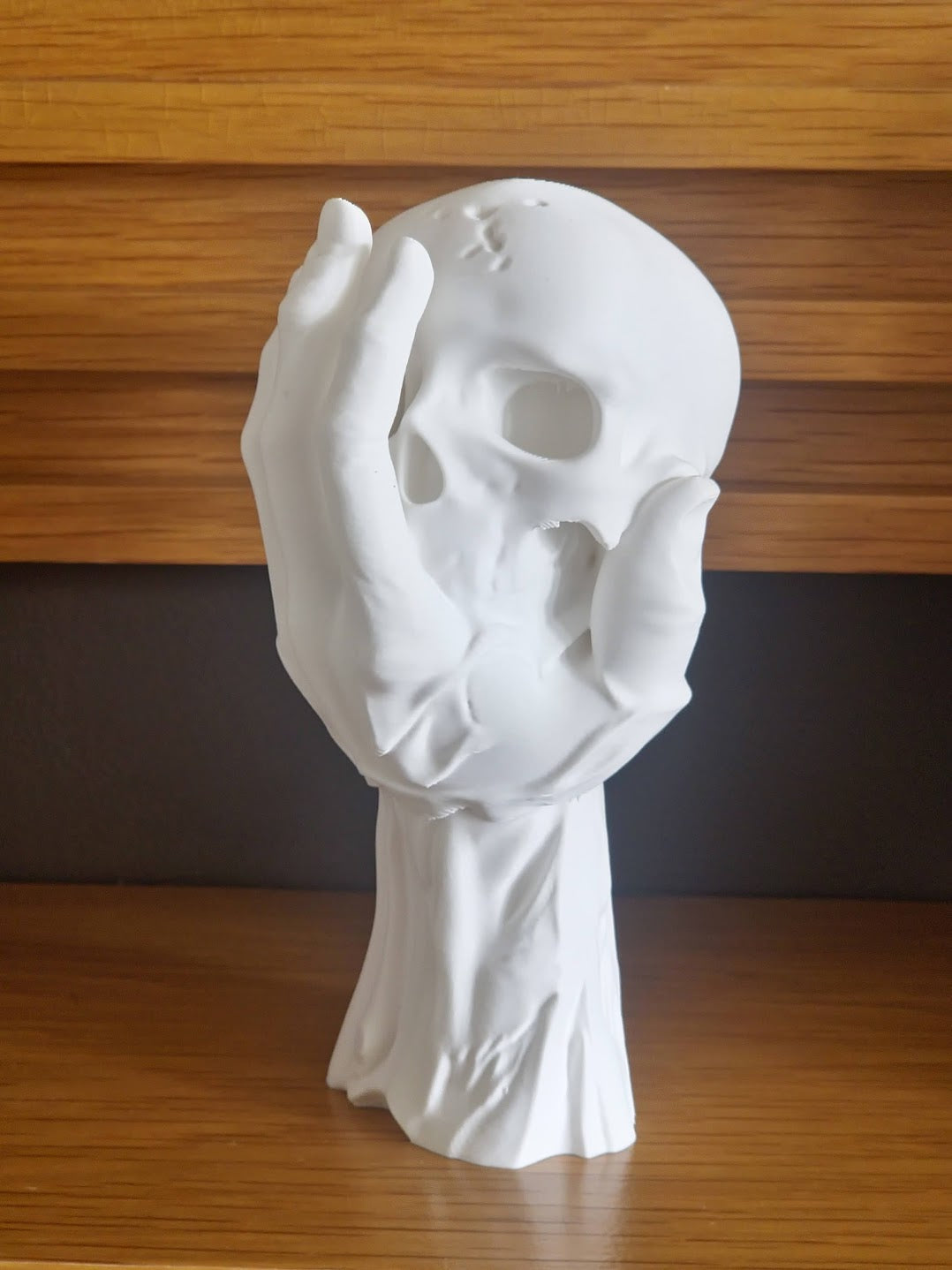 Skull in Hand Ornament