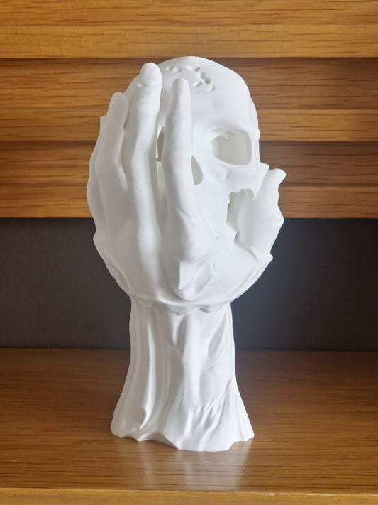 Skull in Hand Ornament